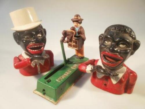 A reproduction novelty money bank and two novelty money boxes.