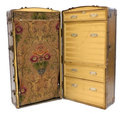 An early 20thC The Victor metal bound trunk, 45cm high, 102cm wide, 56cm deep.