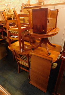 A reproduction twin pedestal extending dining table, set of six matching chairs, oval coffee table, magazine rack and a cabinet. (a quantity)