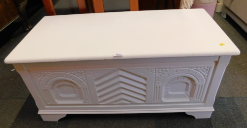 A white painted coffer.