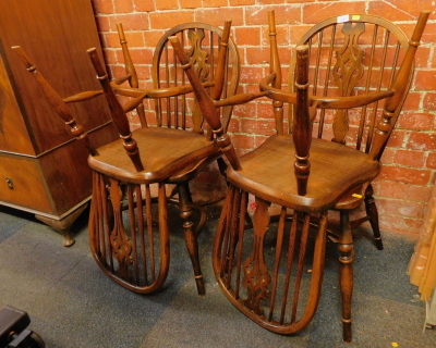 A set of four carved splat dining chairs.