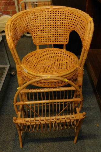 A wicker side chair and magazine rack.