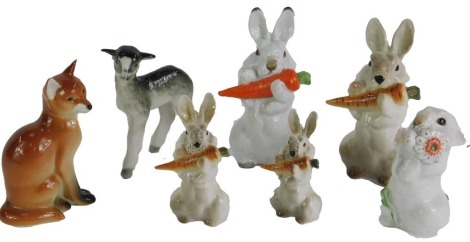 A collection of USSR and other animal ornaments, comprising lamb, five rabbits eating carrots, and a fox, the largest 15cm high. (7)