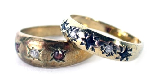 Two dress rings, comprising a 9ct gold and blue and white stone set half hoop dress ring, ring size G½, and a gold coloured white metal three stone dress ring set with three paste stones stamped sil, ring size G, 3g all in. (2)