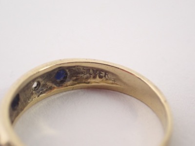 Two dress rings, comprising a 9ct gold and blue and white stone set half hoop dress ring, ring size G½, and a gold coloured white metal three stone dress ring set with three paste stones stamped sil, ring size G, 3g all in. (2) - 2