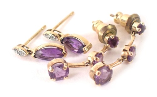 A pair of 9ct gold three tier amethyst drop earrings, with later plated backs, and a pair of amethyst and diamond 9ct gold drop earrings, 2.5g all in. (2 pairs)