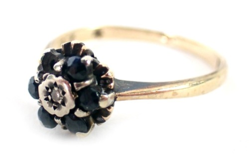 A 9ct gold dress ring, set with sapphire and diamond in a floral cluster, one stone missing, ring size M½, 2.1g.