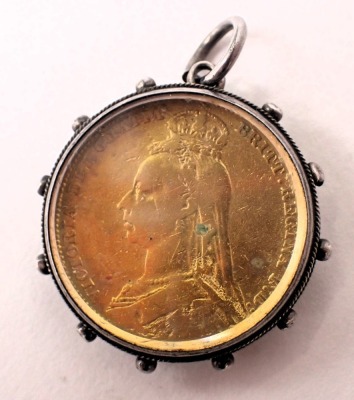 A gilt and enamelled Victorian coin, with silver pendant mount. - 2