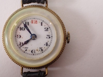 Three wristwatches, comprising a 1950s/60s silver cased gentleman's wristwatch on a leather strap, 27.4g all in, a mother of pearl faced and gilt outer border ladies wristwatch, and a Sitex Sports wristwatch head, in stainless steel case. (3) - 6