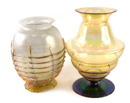 Two Art Glass vases, comprising a silvered and opalescent basket vase, with applied orange and yellow flash detailing, 27cm high, and a yellow ribbed carnival glass type vase, 29cm high. (2)