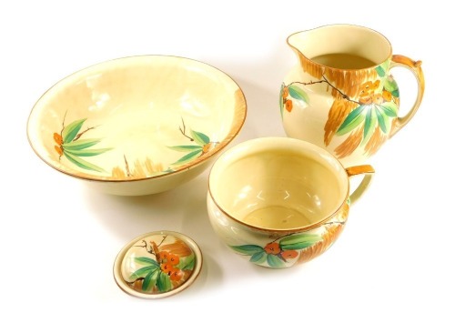 A Myatt and Sons Art Deco bedroom set, comprising wash jug and bowl, chamber pot, lidded soap dish, each on a cream ground decorated with orange flowers. 