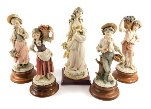 Five Capodimonte style figures, each signed G Guiani, four on circular foot, a later example on square foot, the smallest 26cm high, the largest 29cm high. (5)