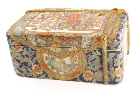 A 20thC Oriental rectangular box and cover, with floral design and raised gilt bow, with two character stamp to underside, 10cm high, 23cm wide, 15cm deep.