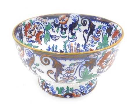 An Amherst ironstone bowl, with a orange rim on a white ground, with blue and orange flowers, 16cm high, 28cm diameter.