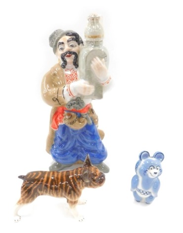 USSR and other porcelain, comprising a blue panda, brown bulldog, and a gentleman carrying oriental vase, the largest, 33cm high. (3)