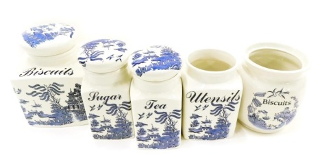 Regal Blue Willow pattern kitchen jars, comprising utensils, biscuits, tea and sugar.