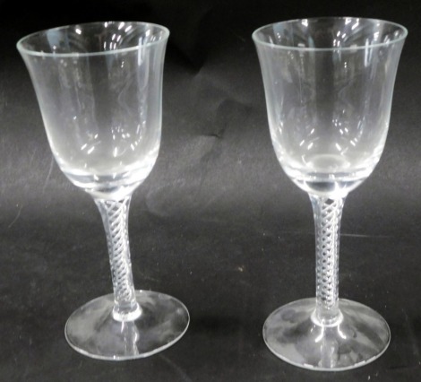 A pair of 20thC air twist stem wine glasses, 16cm high.