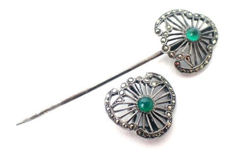 An Art Deco style brooch, set with marcasite and green cabochon stones, fan design with two part pin, white metal unmarked, 7cm diameter, in a Johnson Walkers and Tolhurst of London box.