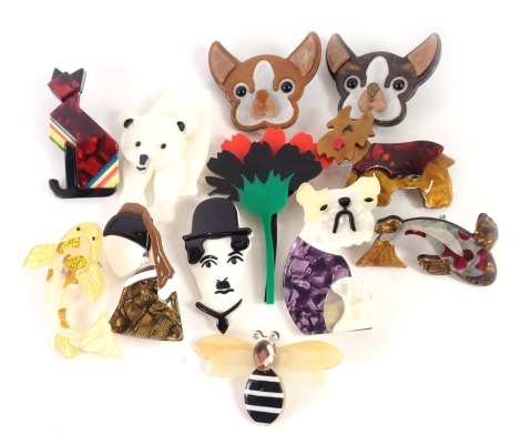 A group of 1960s/70s costume jewellery brooches, each plastic formed of animals to include mainly dogs, dragonflies, and ladies of fashion.