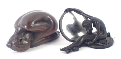 Two bronze effect figures, comprising a D J Scaldwell bronzed effect figure of a nude female curled in a ball, 7cm wide, and a modern example of a nude female arched round mirror, 5cm high. (2)