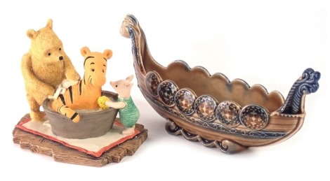 A Board of Fine Arts classic Pooh figure group, Tigger and bath tub, and a Wade Viking boat boxed. (2)