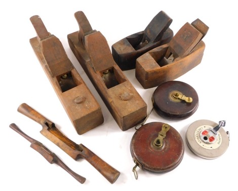 Two vintage wood block planes, a group of leather bound outer tape measures, etc.