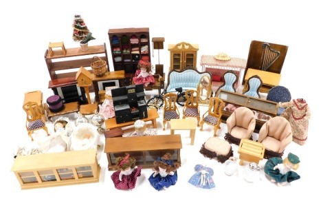 An extensive collection of dolls house furniture, comprising stools, kitchen cabinets, furniture, chairs, etc. (1 box)