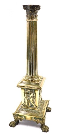 A late 19th/early 20thC brass Corinthian column table lamp, cast with Neoclassical figures, on paw feet, incomplete, 49cm high.