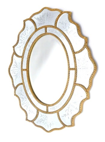 A Venetian style gilt wall mirror, with smoked and patterned panels, with beaded border and central oval section, 82cm high, 66cm wide.