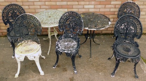 A Coalbrookdale style garden set, comprising two circular tables, and five various chairs, each with fan pierced back, both later painted, 63cm high, 70cm diameter. (7, AF)