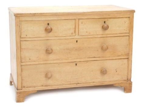 A Victorian stripped pine chest, with two short and two long drawers, with knob handles and bracket feet, 113cm wide.