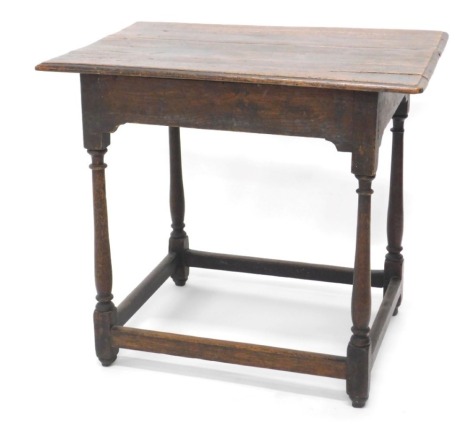 A 17thC oak side table, with moulded top, turned legs, and square stretchers, 67cm high, 75cm wide, 55cm deep.