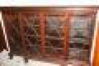 A mahogany breakfront bookcase in the Chippendale manner