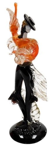 A Murano glass figure of a male Flamenco dancer, modelled standing, in orange and black, on a circular base, 47cm high.