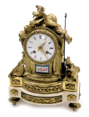 A late 19thC French ormolu marble and porcelain mantel clock, circular enamel dial bearing Roman numerals, eight day movement with bell strike, the case surmounted by a pair of doves and a torchere, and the sides with symbols of music and war, raised on a