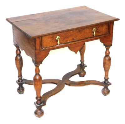 A William and Mary style oak side table, with one long frieze drawer, raised on turned legs united by a X framed stretcher, on bun feet, 70cm high, 77cm wide, 49cm deep.