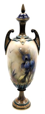 A late 19thC Hadleys porcelain vase and cover, of twin handled baluster form, painted centrally with irises, grasses and a dragonfly, printed and painted marks, 41cm high. (AF)