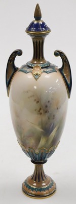 A late 19thC Hadleys porcelain vase and cover, of twin handled baluster form, painted centrally with irises, grasses and a dragonfly, printed and painted marks, 41cm high. (AF) - 2