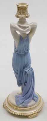 A late 19thC Royal Worcester glazed and bisque porcelain figural candlestick, modelled as a Roman woman, raised on a stepped circular base, and three scroll feet, impressed mark, 33cm high. - 2