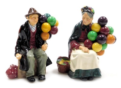 A Royal Doulton figure modelled as The Balloon Man, HN1954, together with a figure modelled as The Old Balloon Seller, HN1315. (AF, 2)