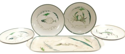 A late 20thC Poole pottery fish service, decorated with fish, a crayfish, crab, snail and shells, comprising an oval dish and six plates, printed marks.