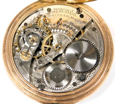 A Waltham gold plated gentleman's pocket watch, open faced, key less wind, circular enamel dial bearing Roman numerals, subsidiary seconds dial, 17 jewelled movement no. 16759617, the case of plain form, on an oval link Albert chain, with T-bar and two lo - 6