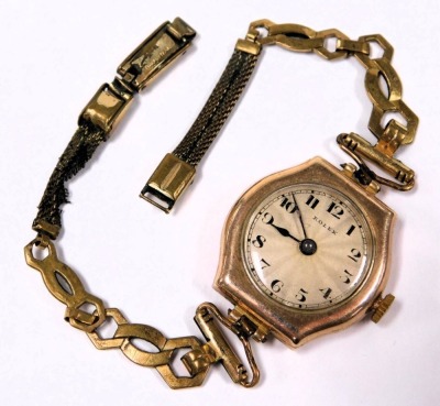 A mid century Rolex 9ct gold cased lady's wristwatch, circular dial with engine turned decoration, bearing Arabic numerals, on a plated bracelet strap. - 5