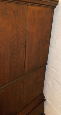 An 18thC oak chest on stand, the outswept pediment over two short above two long drawers, the base with a further long drawer, raised on bun feet, 117cm high, 90.5cm wide, 56cm deep. - 3