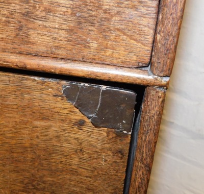 An 18thC oak chest on stand, the outswept pediment over two short above two long drawers, the base with a further long drawer, raised on bun feet, 117cm high, 90.5cm wide, 56cm deep. - 4