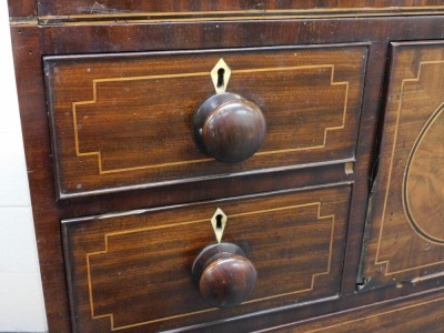 A mahogany and line inlaid secretaire chest, the central fall opening to reveal four drawers and six recesses, flanked by two short and one deep drawer, over three long graduated drawers, raised on splayed feet, 123cm high, 126cm wide, 56cm deep. Ivory li - 2