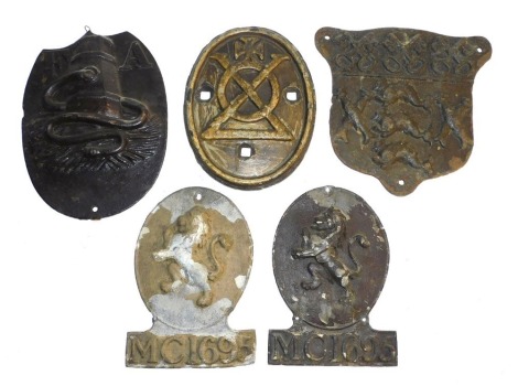 Various property marks, including two lead marks with rampant lion and raised inscription MC1695, and three cast iron property marks, one with crosses and another with crossed keys, the other marks FA with cistern and hose. (5)