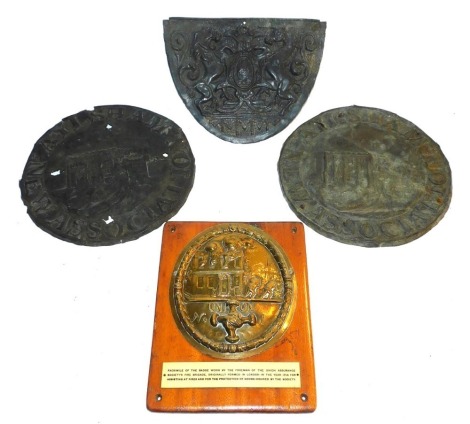 Four various property marks, including two copper signs for Aylsham New Association, another property mark and a facsimile of the badge worn by the foreman of the Union Assurance Societies Fire Brigade, mounted on a wooden plaque. (4)