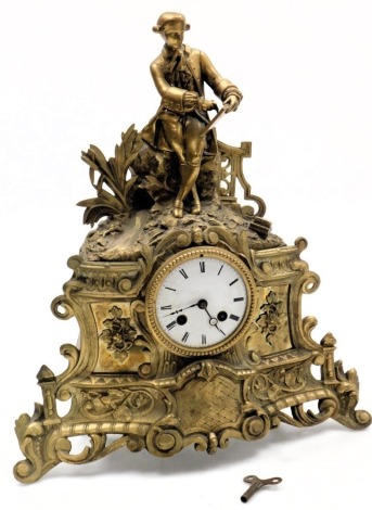 A late 19thC French brass cased mantel clock, circular enamel dial bearing Roman numerals, eight day movement with bell strike, the case stamped Labolle, surmounted with a figure of a writer against a naturalistic garden ground, above floral panels and ro