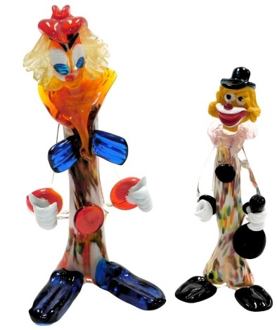 A Murano glass figure of a clown, with an orange collar and blue bow tie, 34cm high, and a further figure of a clown holding a musical instrument, 27cm high. (2)